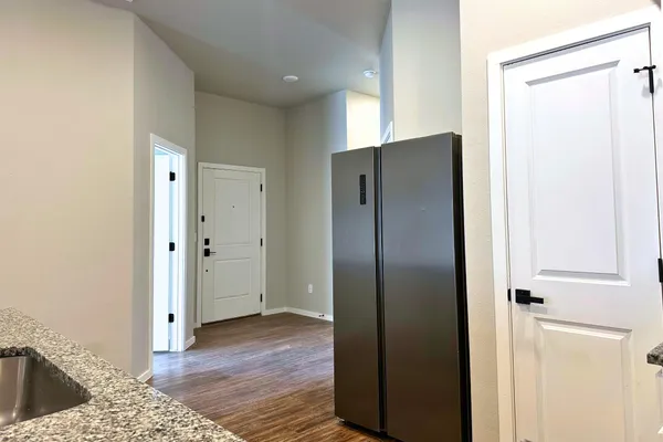 a view of cabinet with wooden floor