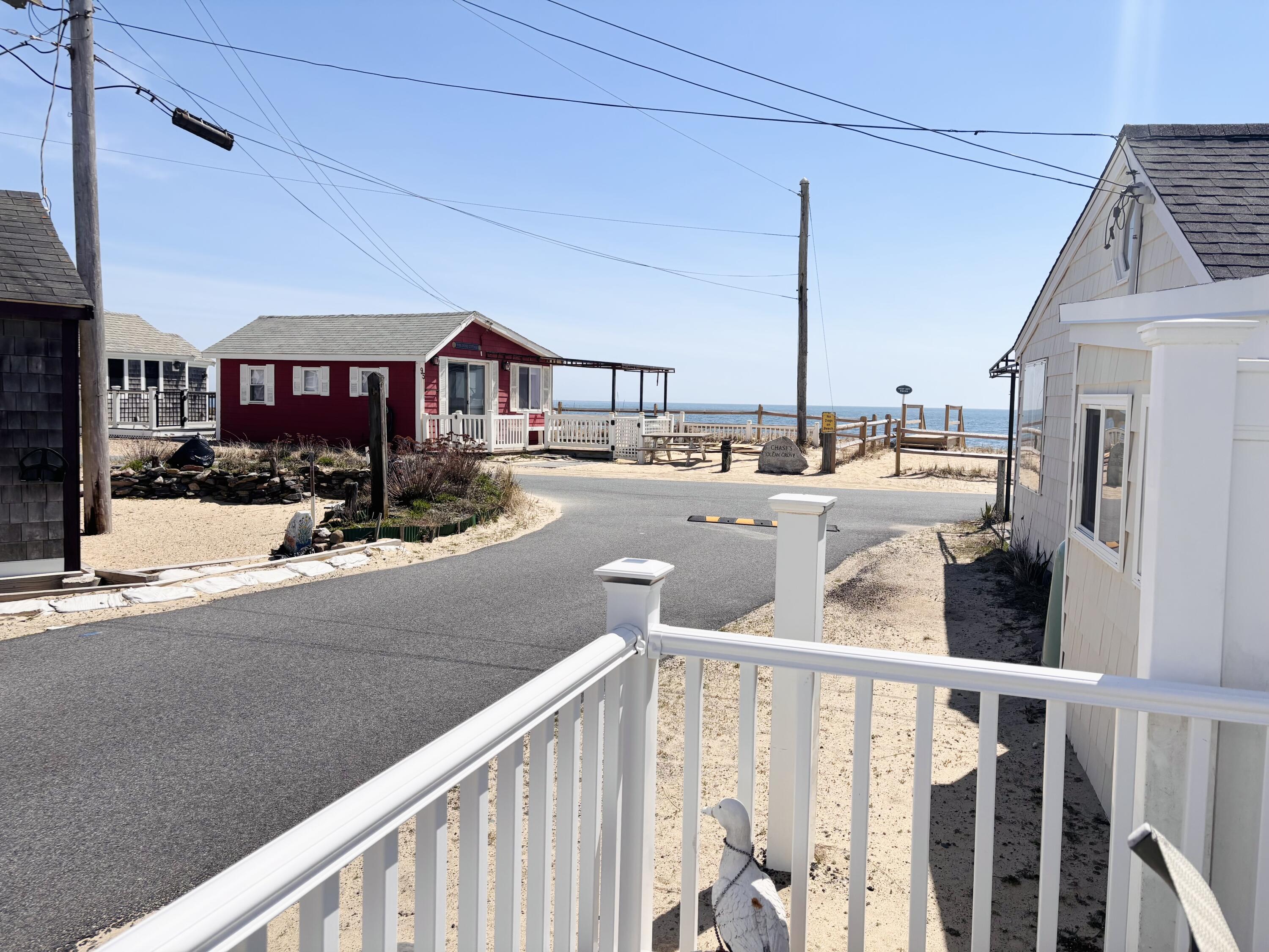 241 Old Wharf Road, Unit 91 Dennis Port, MA 02639 - Photo 4 of 16 a view of a house with a patio