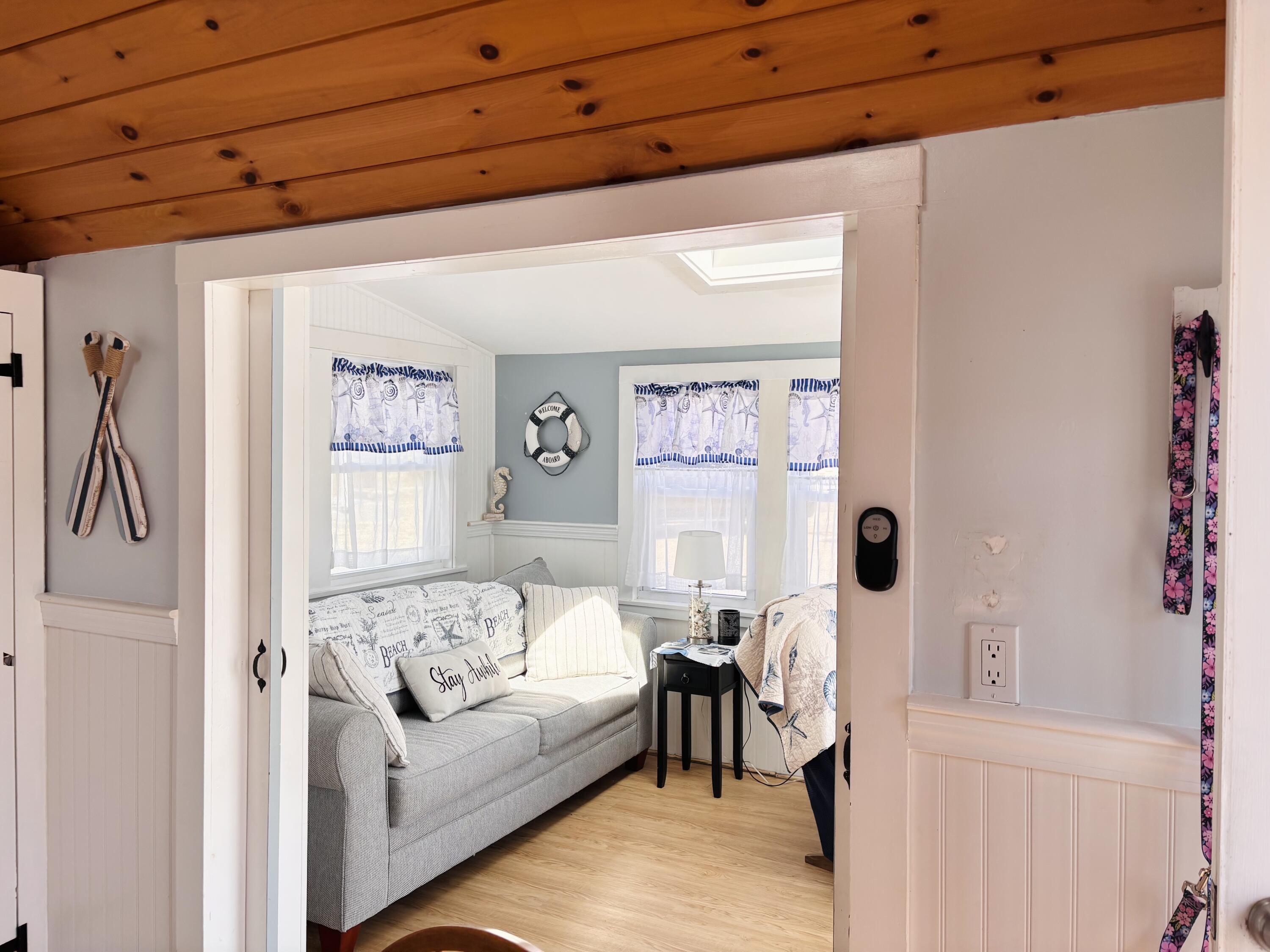 241 Old Wharf Road, Unit 91 Dennis Port, MA 02639 - Photo 8 of 16 a living room with furniture and a window