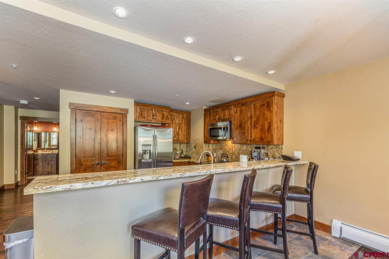 24 Sheol Street, Unit 504 Durango, CO 81301 - Photo 16 of 30 a kitchen with a table and chairs in it