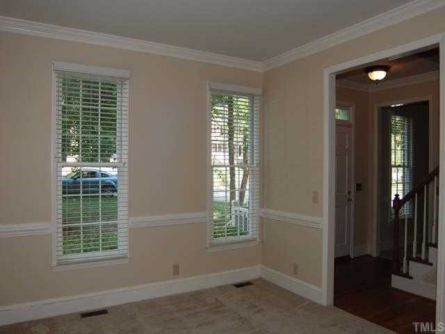 6804 Chasewick Circle Raleigh, NC 27615 - Photo 3 of 12 an empty room with windows