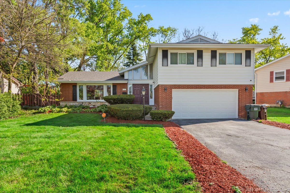 18847 May Avenue Homewood, IL 60430 - Photo 1 of 26 a front view of a house with a yard and porch