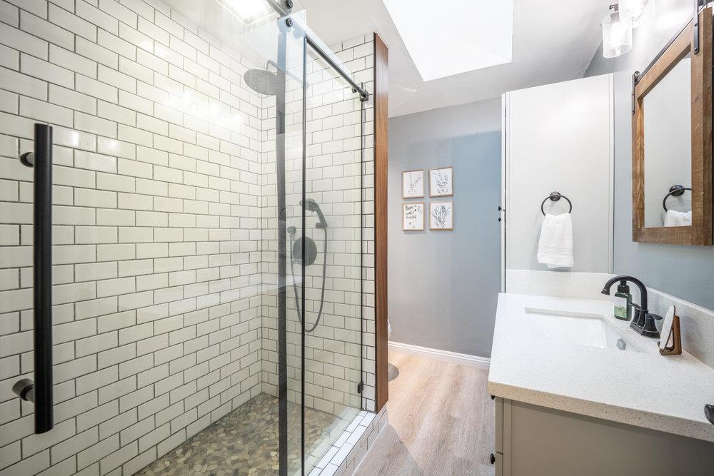 740 Roble Drive Morgan Hill, CA 95037 - Photo 17 of 43 a bathroom with a sink and a mirror