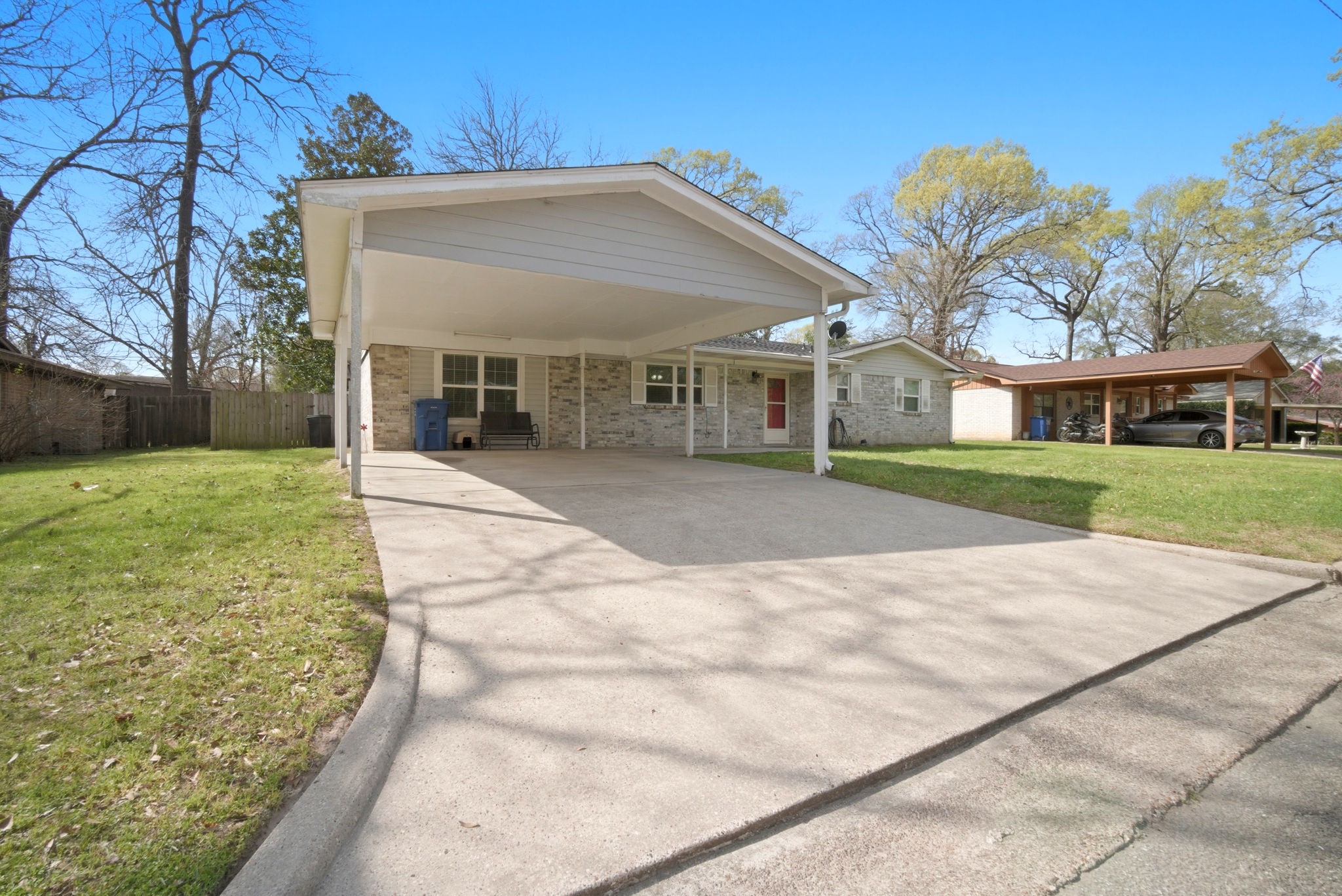 209 Red Oak Street Livingston, TX 77351 - Photo 28 of 34 Side view Carport