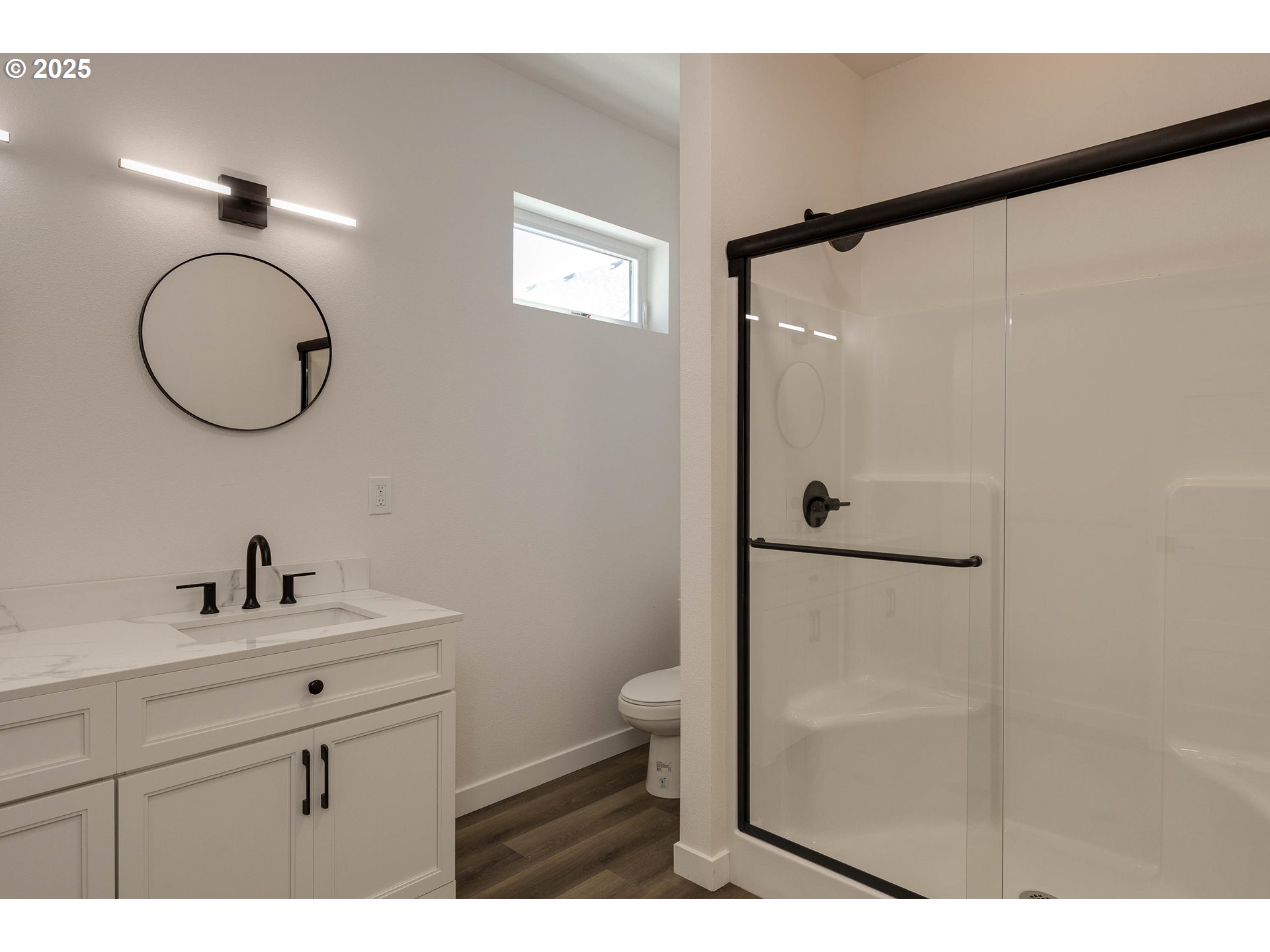 4801 Southeast Ina Avenue Milwaukie, OR 97267 - Photo 11 of 25 a bathroom with a sink mirror toilet and vanity