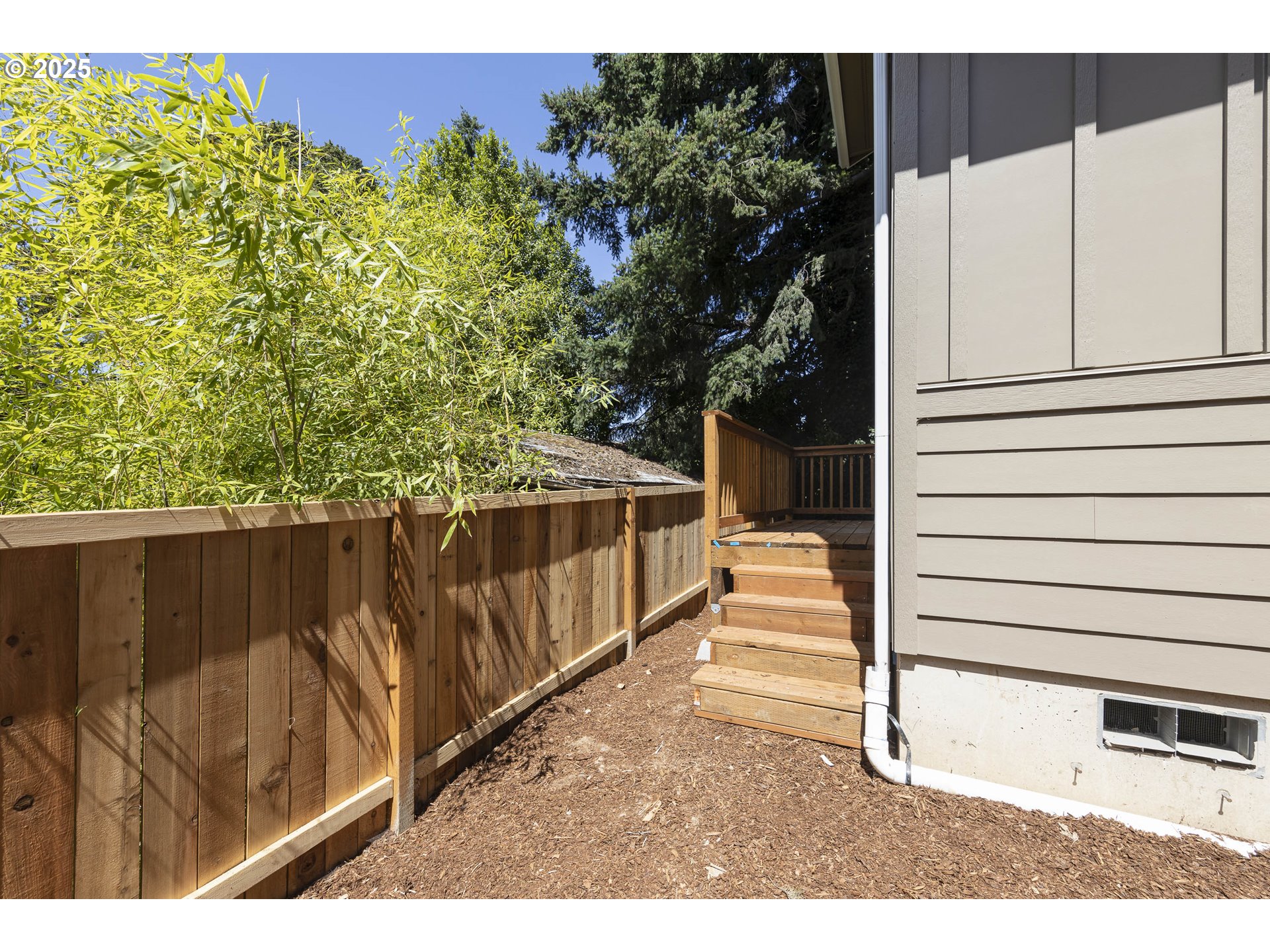 4801 Southeast Ina Avenue Milwaukie, OR 97267 - Photo 17 of 25 a view of a balcony with wooden floor and fence