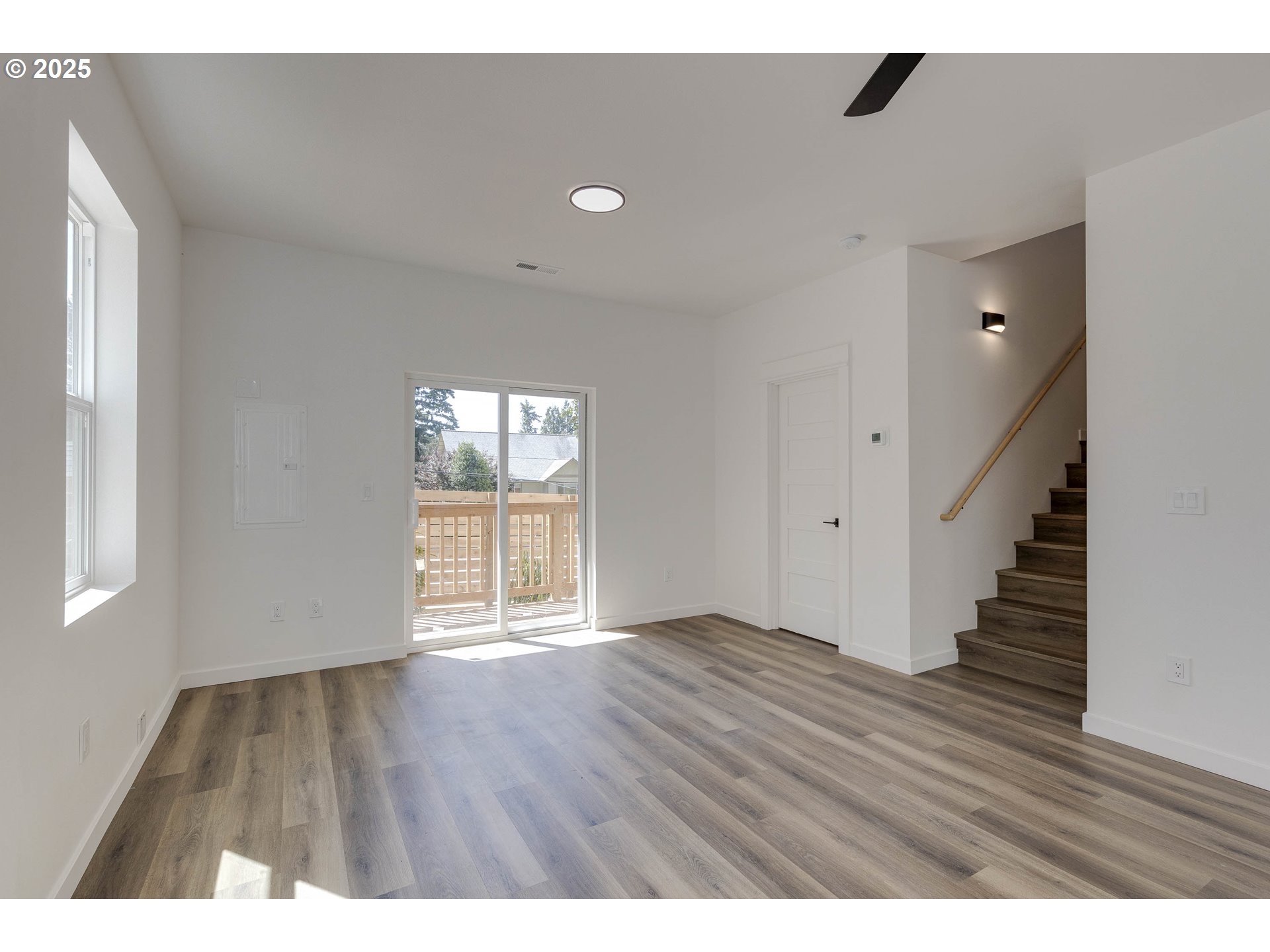 4801 Southeast Ina Avenue Milwaukie, OR 97267 - Photo 20 of 25 a view of an empty room with wooden floor and a window