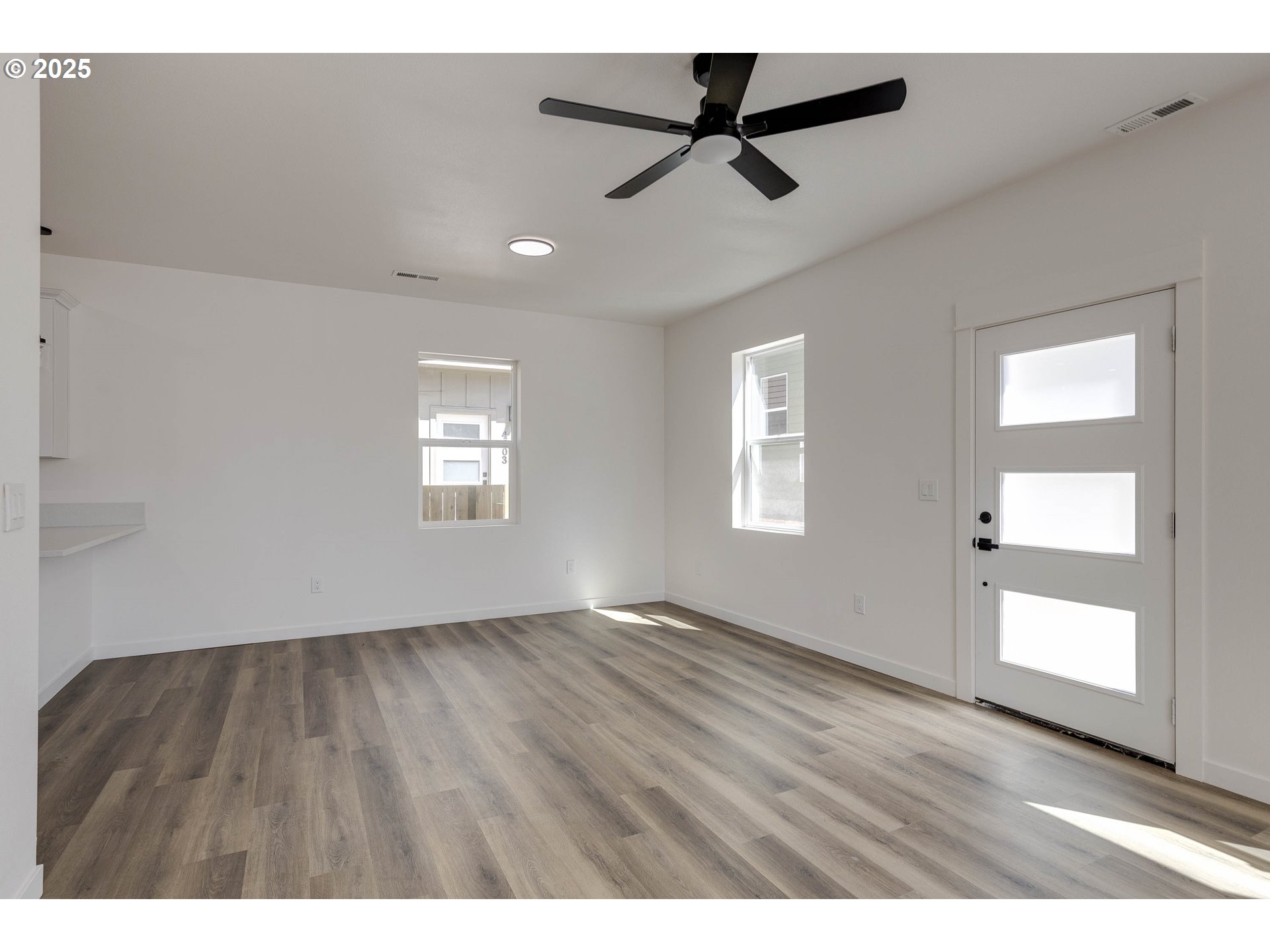 4801 Southeast Ina Avenue Milwaukie, OR 97267 - Photo 24 of 25 wooden floor in an empty room with a window