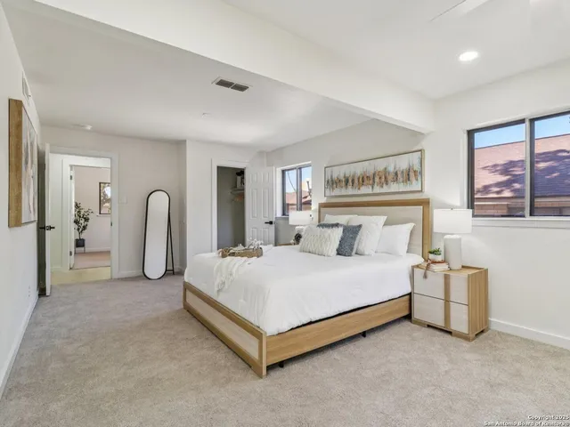 a bedroom with a bed and a dresser