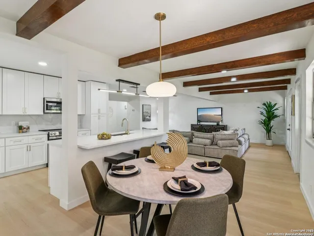 a dining room with furniture and window