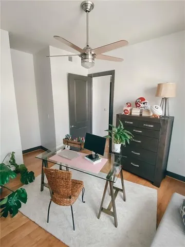 a bathroom with a granite countertop sink a toilet and a mirror