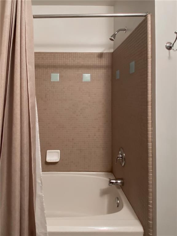 747 Ralph McGill Boulevard Northeast, Unit 217 Atlanta, GA 30312 - Photo 18 of 28 a bathroom with a shower