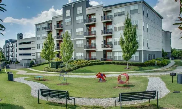 a view of a two chairs and a table in a patio