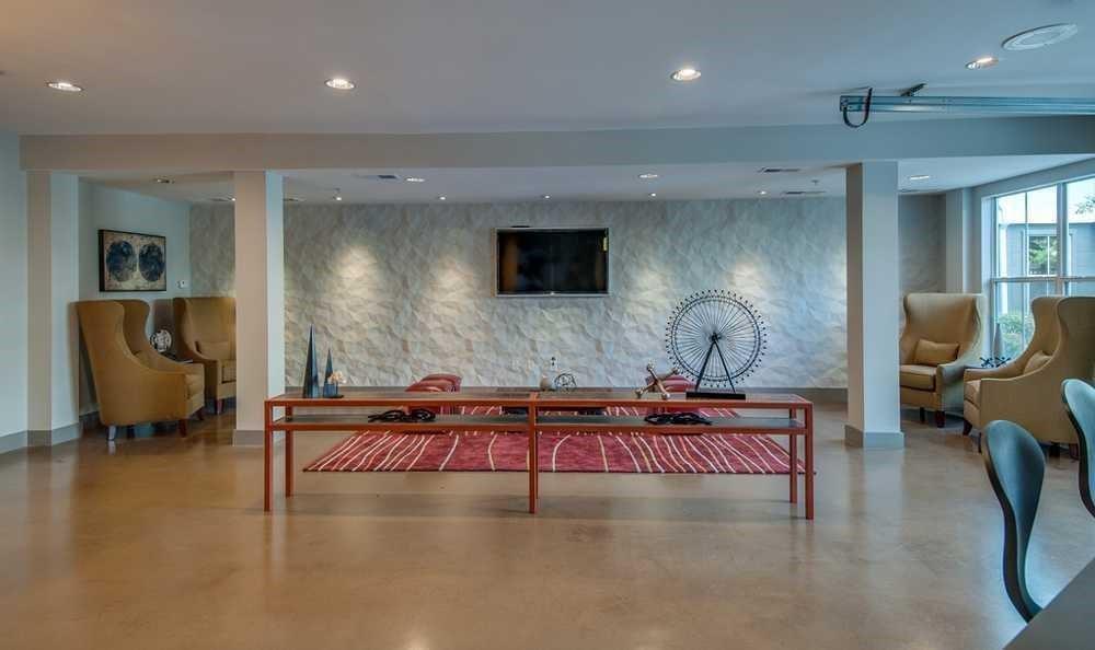 747 Ralph McGill Boulevard Northeast, Unit 217 Atlanta, GA 30312 - Photo 24 of 28 a living room with furniture and a flat screen tv
