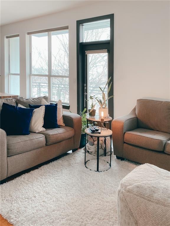 747 Ralph McGill Boulevard Northeast, Unit 217 Atlanta, GA 30312 - Photo 5 of 28 a living room with furniture and a large window