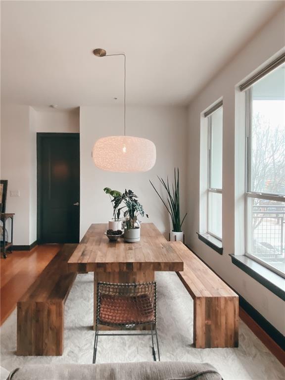 747 Ralph McGill Boulevard Northeast, Unit 217 Atlanta, GA 30312 - Photo 8 of 28 a living room with furniture and a large window