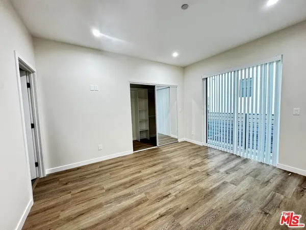 a view of a livingroom with wooden floor