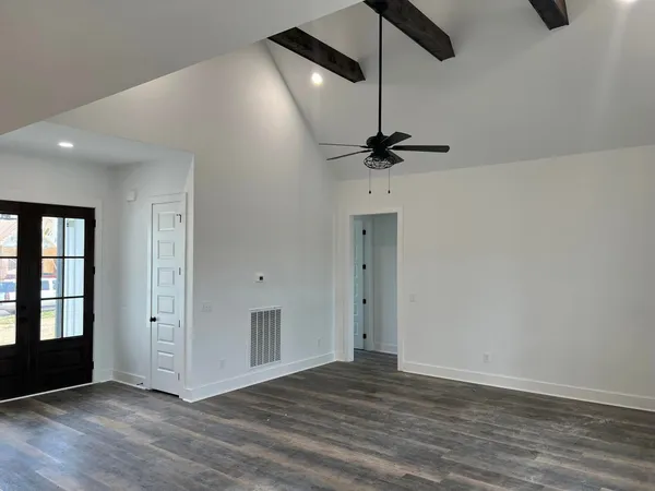 a view of an empty room with a window