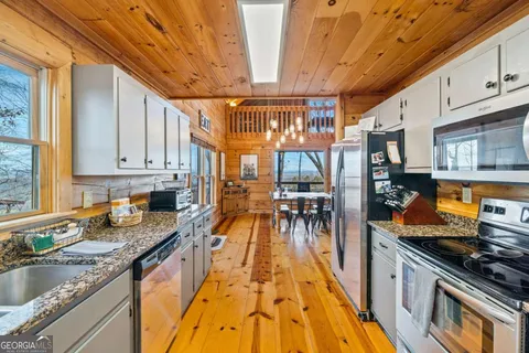 a dining room with a table and chairs
