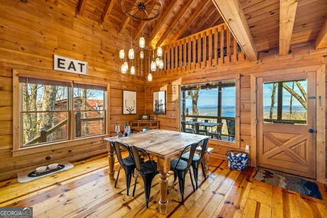 a living room with furniture a fireplace and a ceiling fan