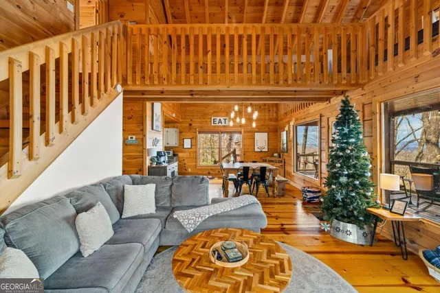 a view of a patio with couches chairs and a kitchen view