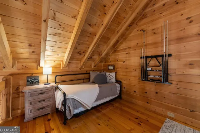 a bathroom with a granite countertop sink and a large mirror