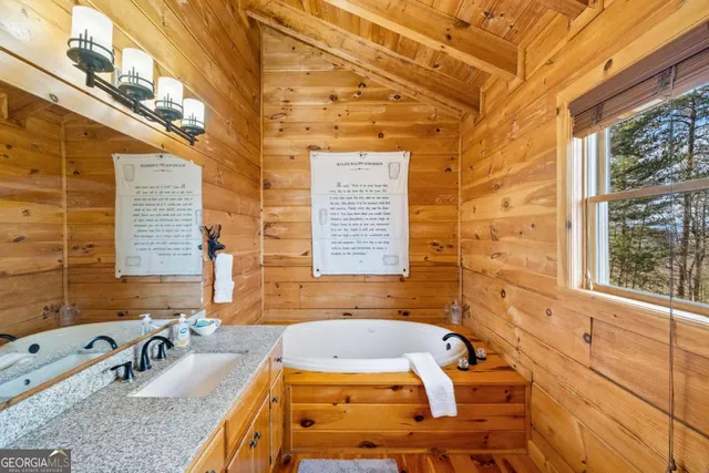 a view of a chairs and table in the balcony