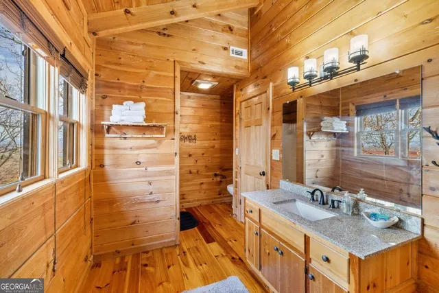 a view of balcony with wooden floor and outdoor seating