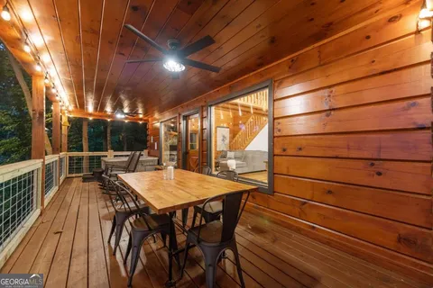 a roof deck with couch and chairs