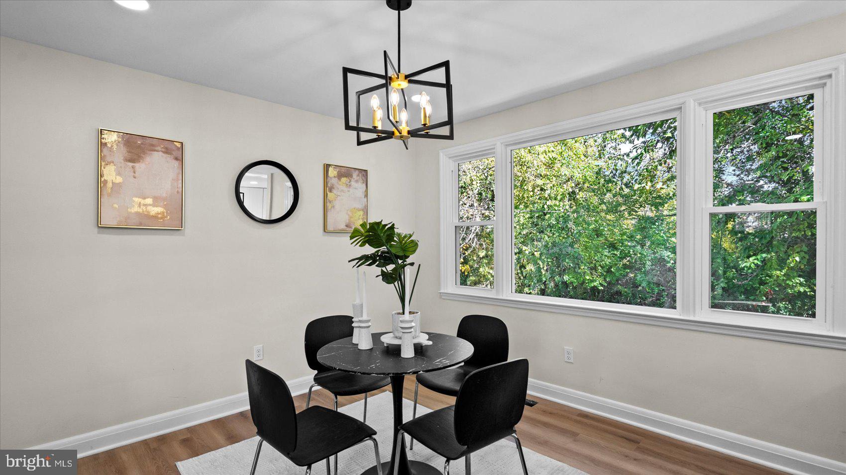 711 West Hills Road Baltimore, MD 21229 - Photo 11 of 52 a dining room with furniture and a window