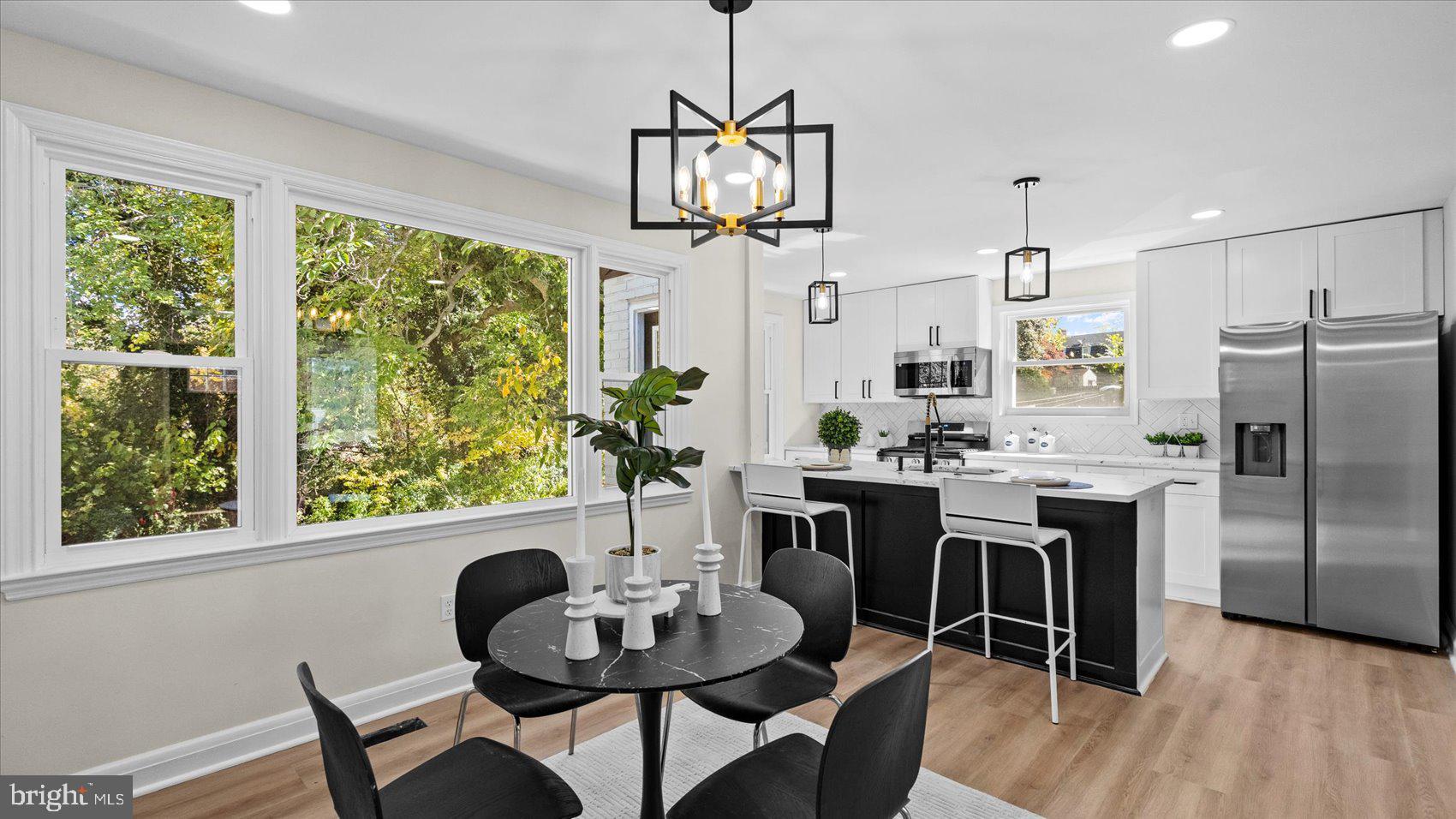 711 West Hills Road Baltimore, MD 21229 - Photo 12 of 52 a view of a dining room with furniture window and wooden floor