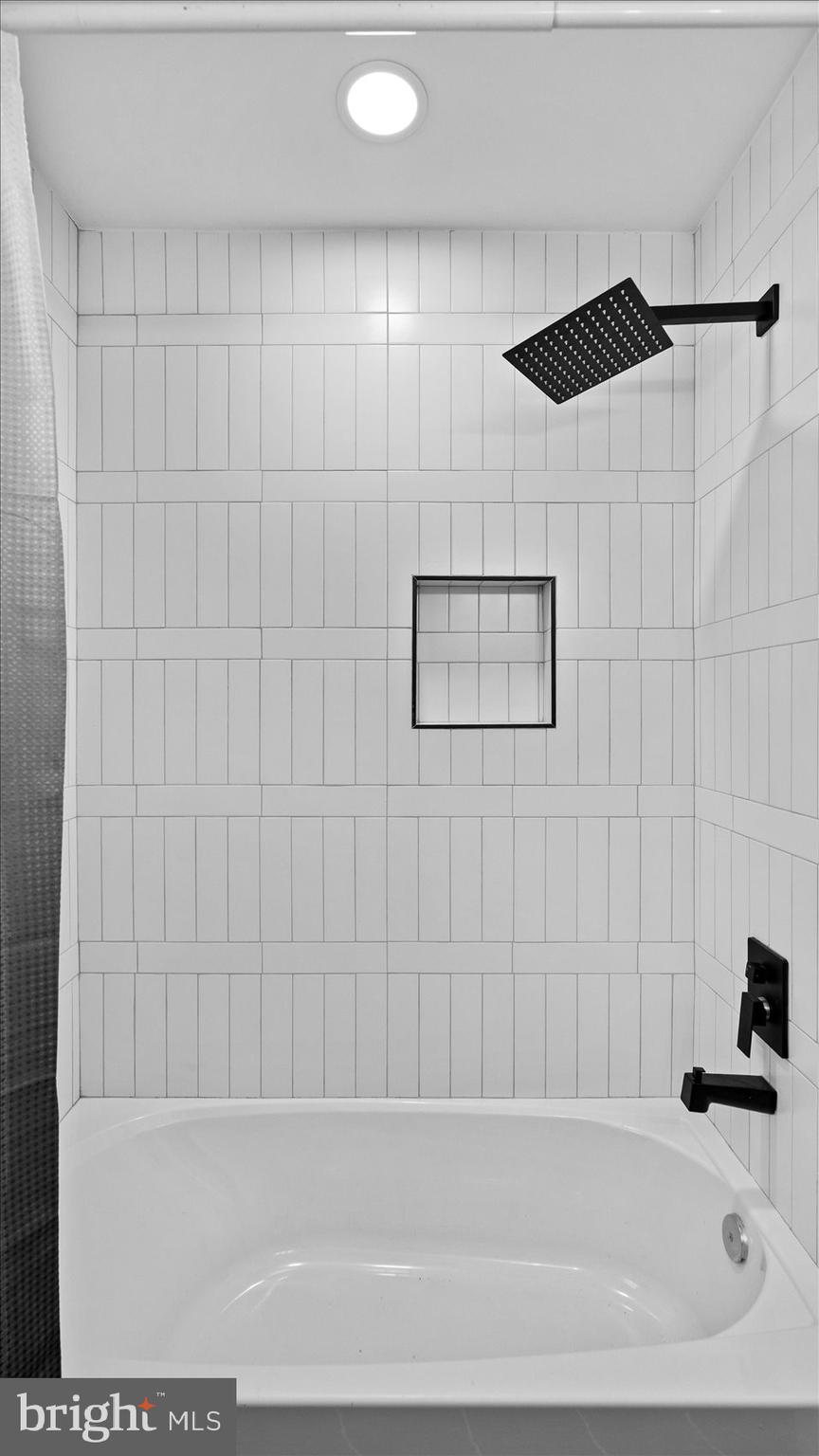 711 West Hills Road Baltimore, MD 21229 - Photo 34 of 52 a bathroom with a bathtub and a shower