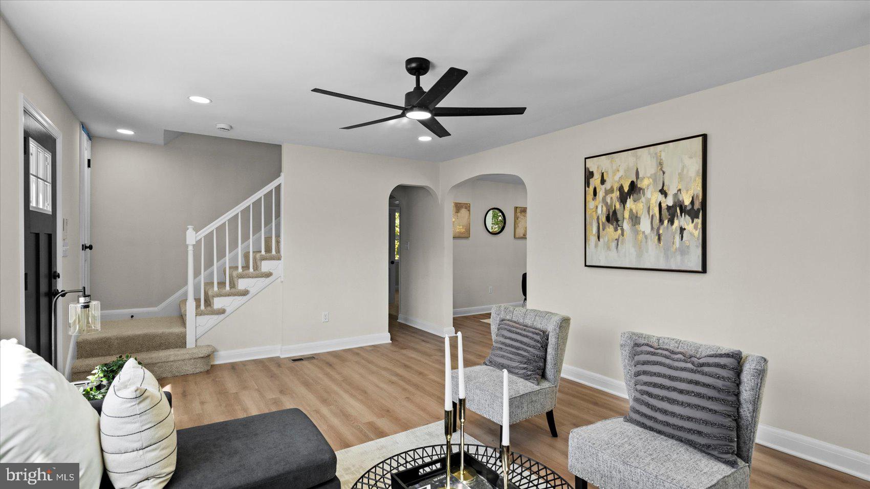 711 West Hills Road Baltimore, MD 21229 - Photo 9 of 52 a living room with furniture and a wooden floor