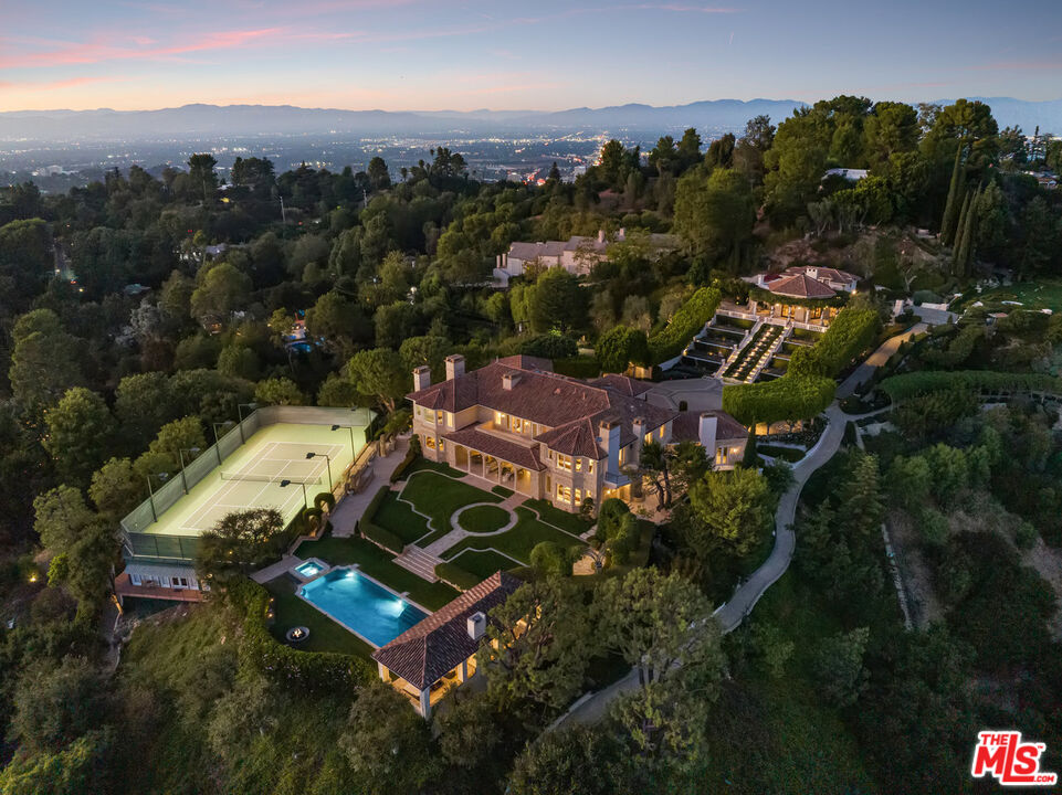 an aerial view of a house with a garden