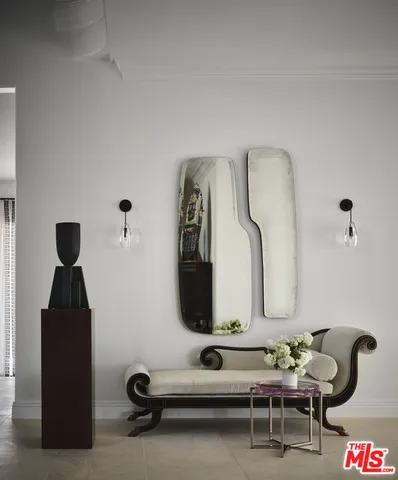 a living room with furniture large window and a fireplace