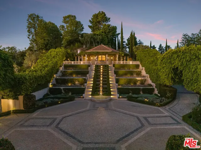 a view of a chairs and table in patio with a fire pit