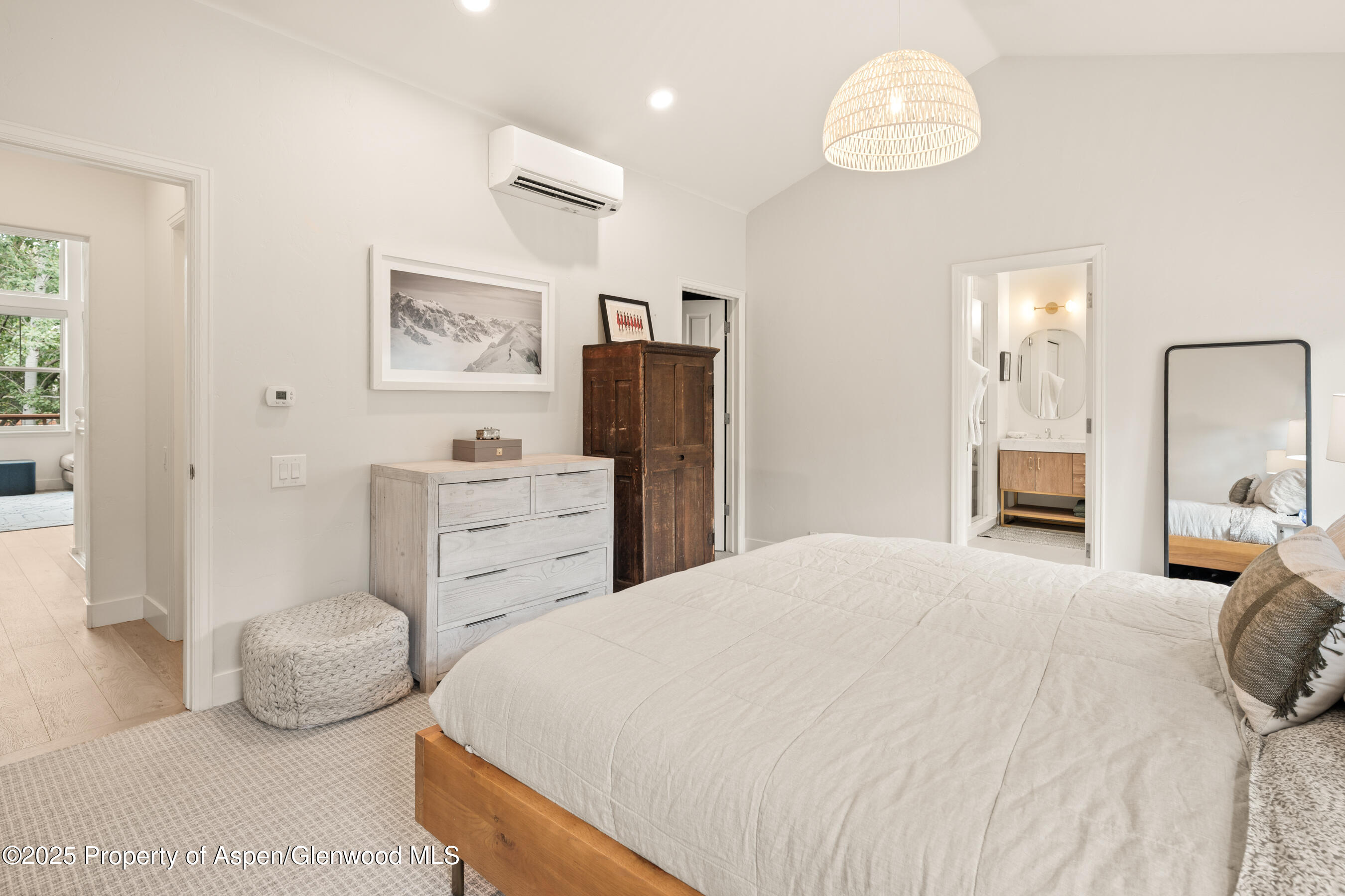 545 Evans Court Basalt, CO 81621 - Photo 12 of 25 a bedroom with a bed and wooden floor