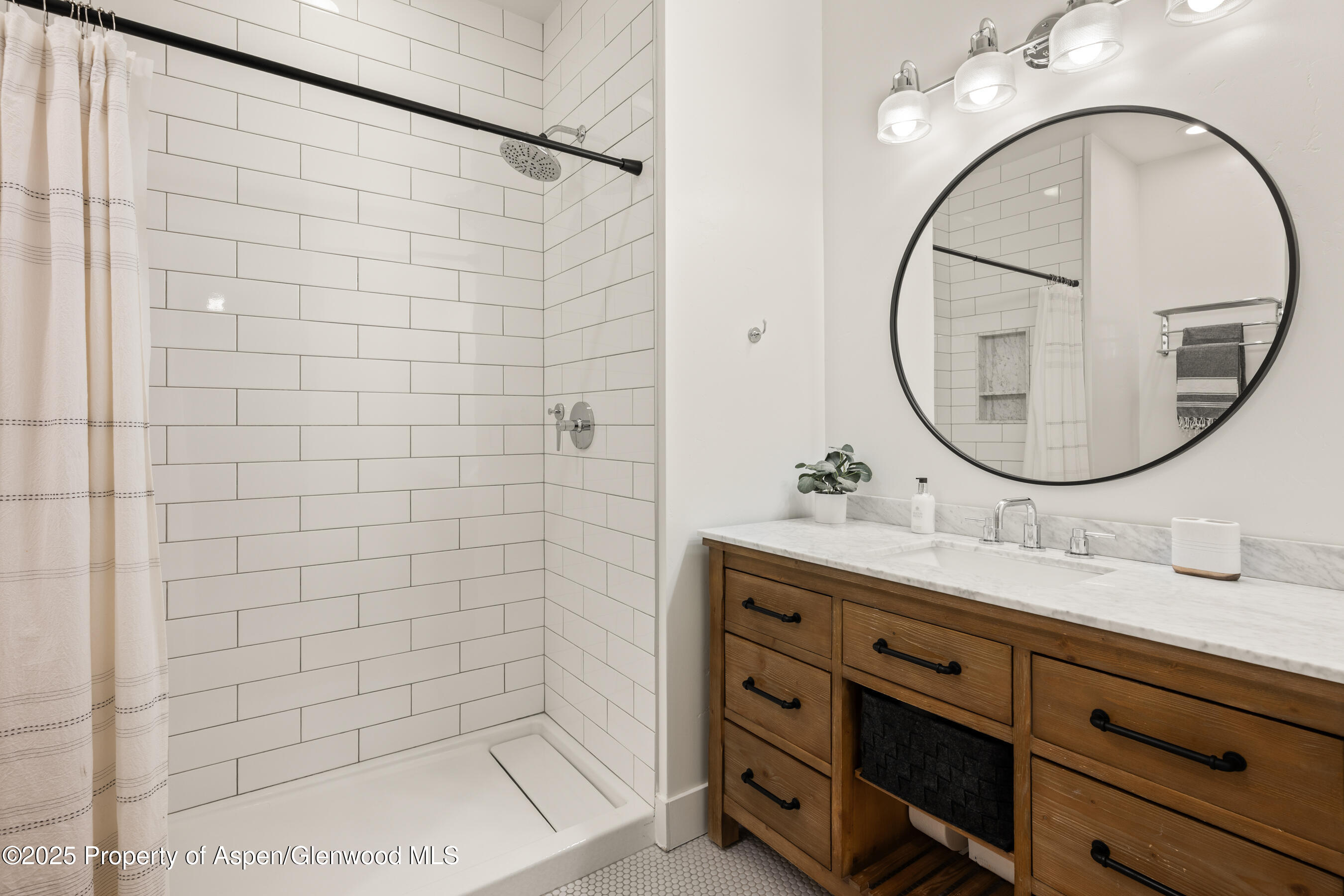545 Evans Court Basalt, CO 81621 - Photo 14 of 25 a bathroom with a sink and a mirror