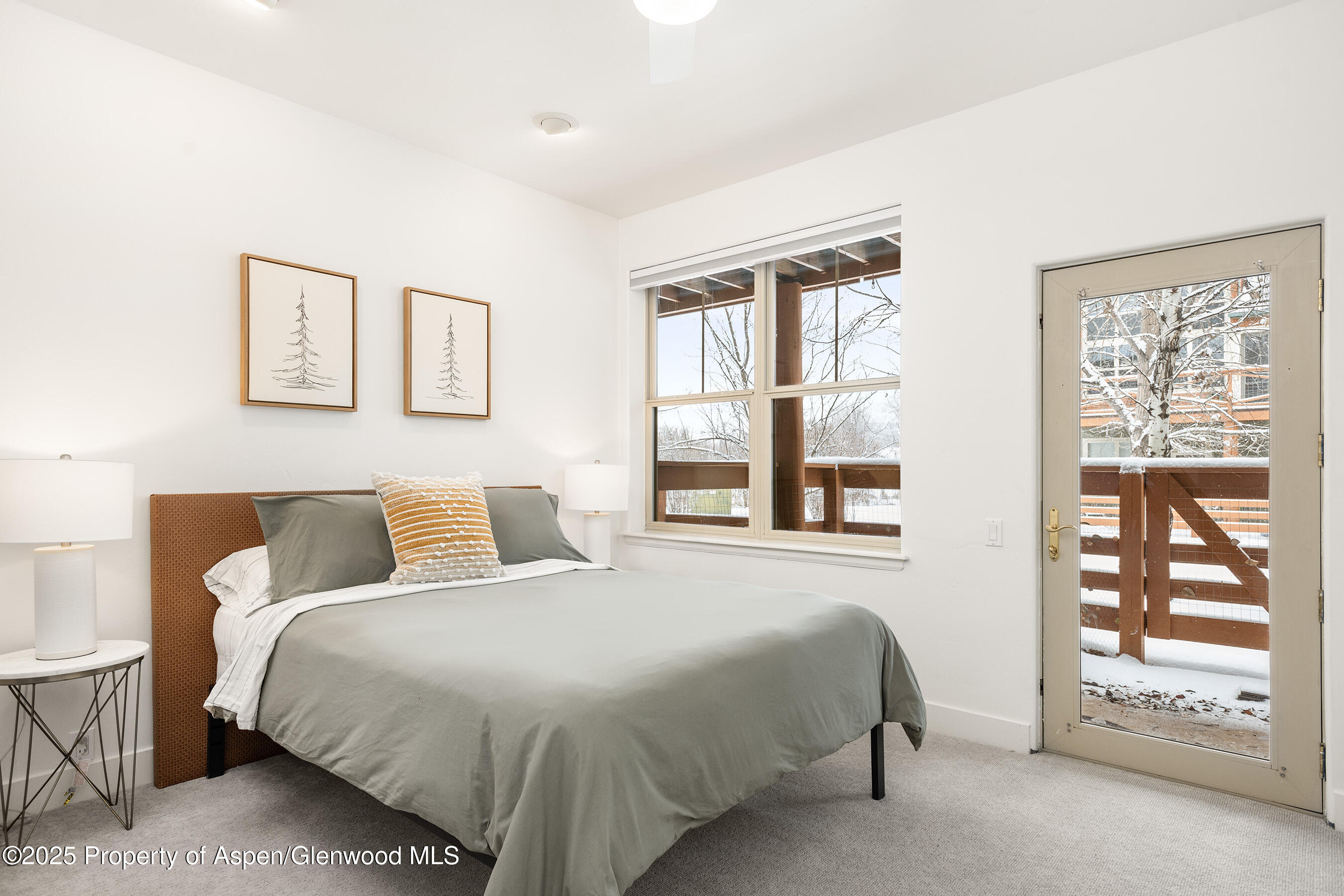 545 Evans Court Basalt, CO 81621 - Photo 17 of 25 a bedroom with a bed and a large window
