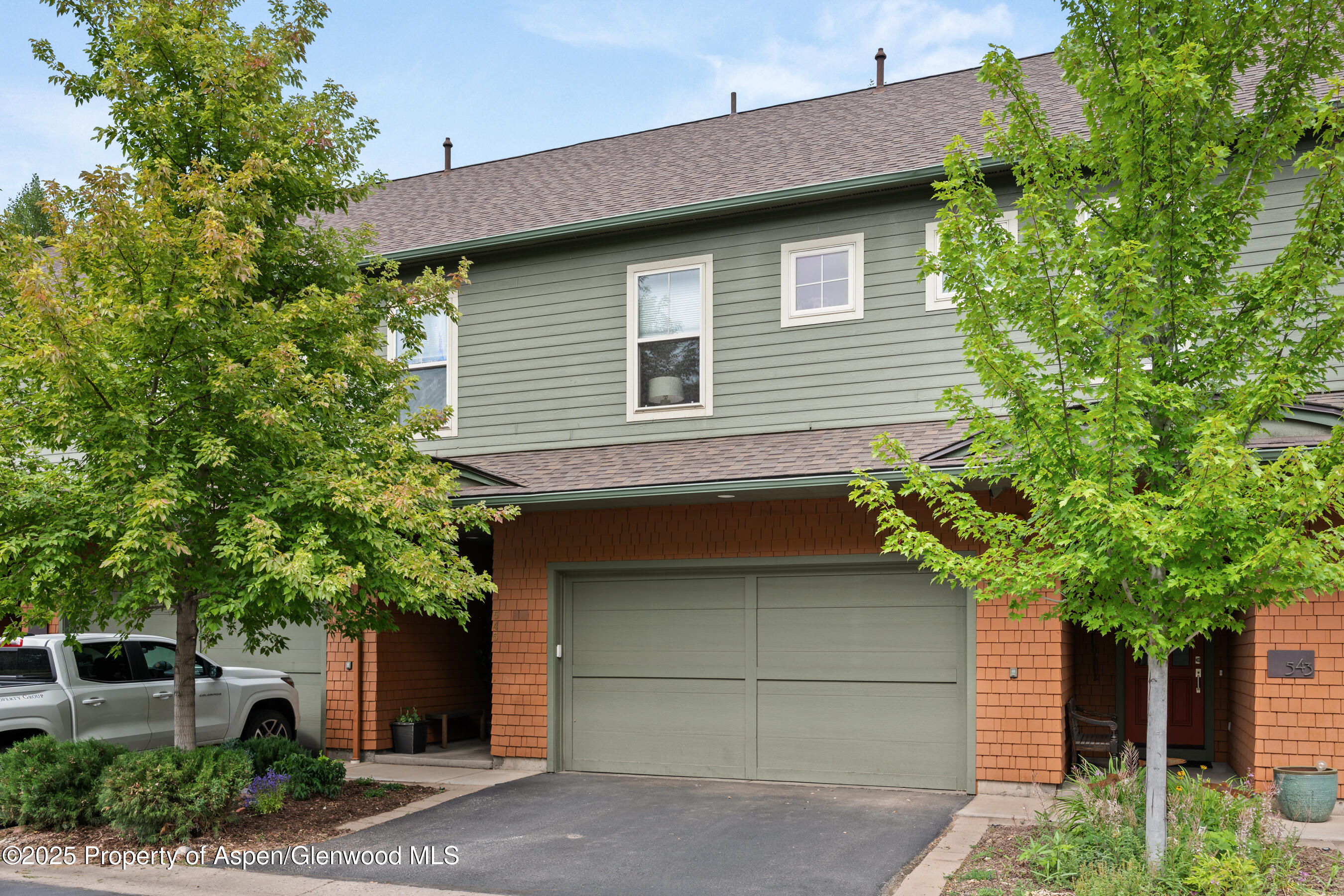 545 Evans Court Basalt, CO 81621 - Photo 23 of 25 a house that has a tree in front of the house