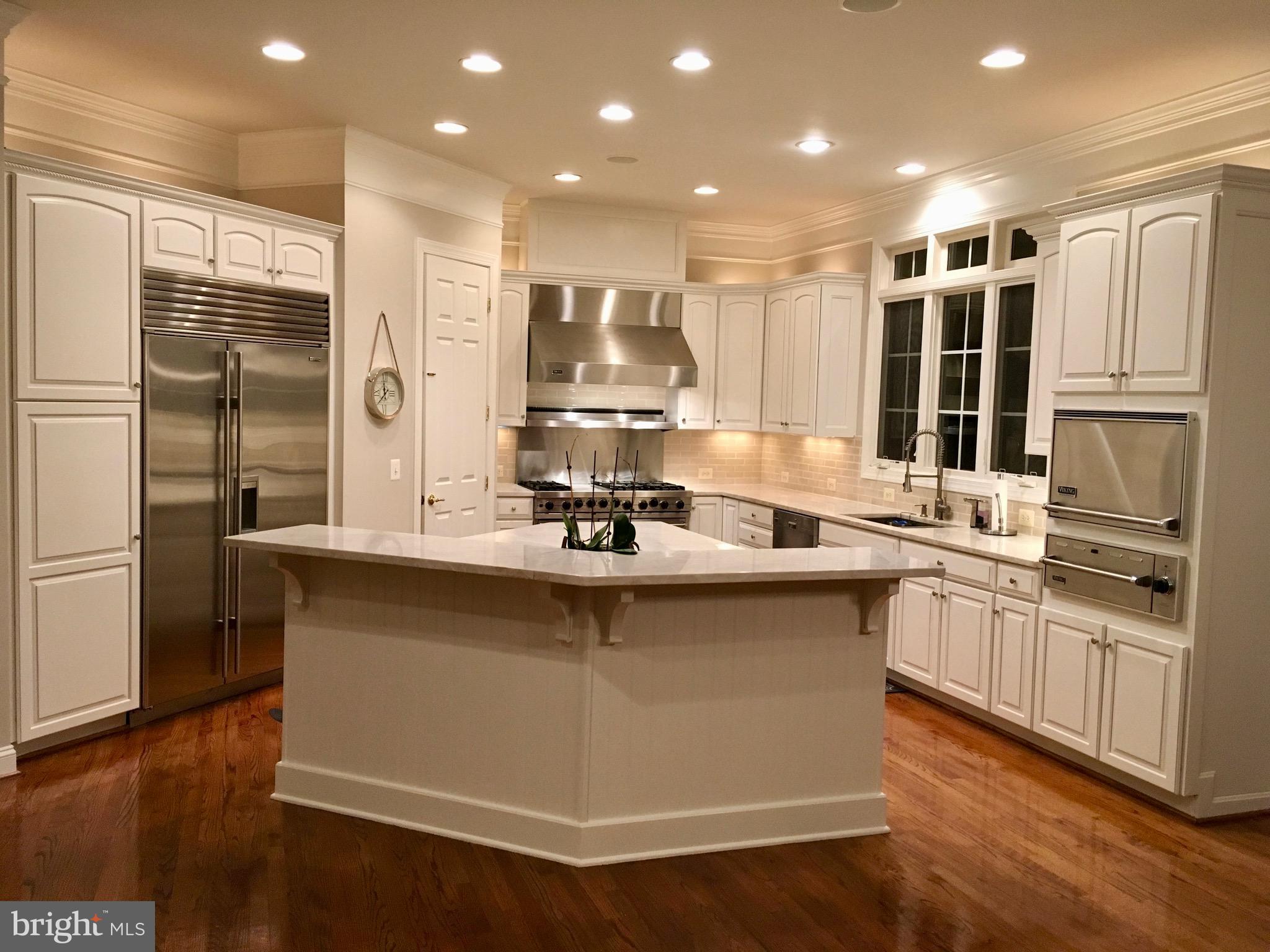43295 Fieldsview Court Leesburg, VA 20176 - Photo 4 of 30 a kitchen with stainless steel appliances granite countertop a sink stove and refrigerator