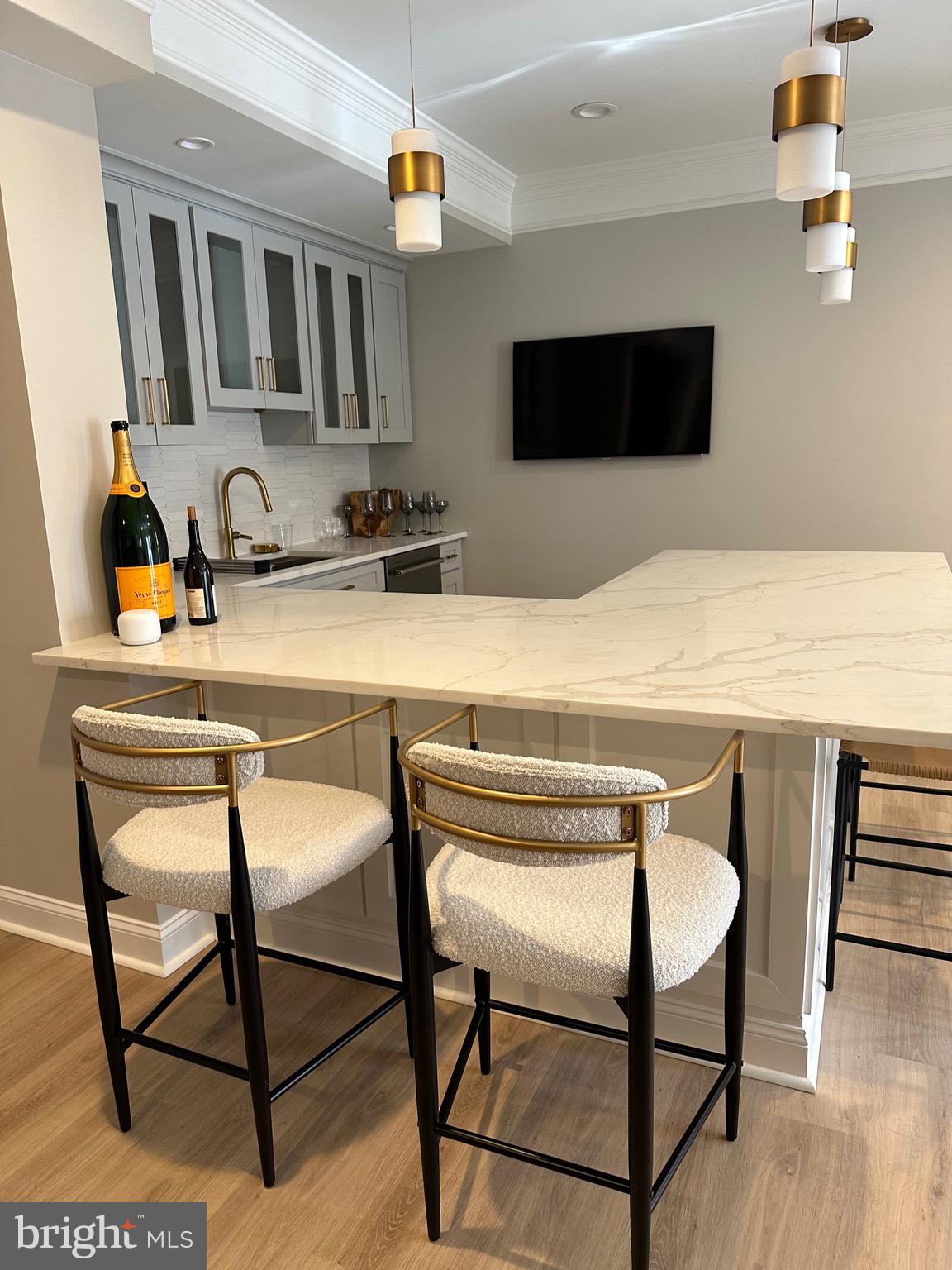 43295 Fieldsview Court Leesburg, VA 20176 - Photo 10 of 30 a kitchen with a table chairs and a refrigerator