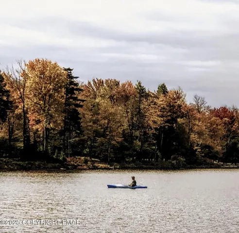 front view of a brick house with a yard