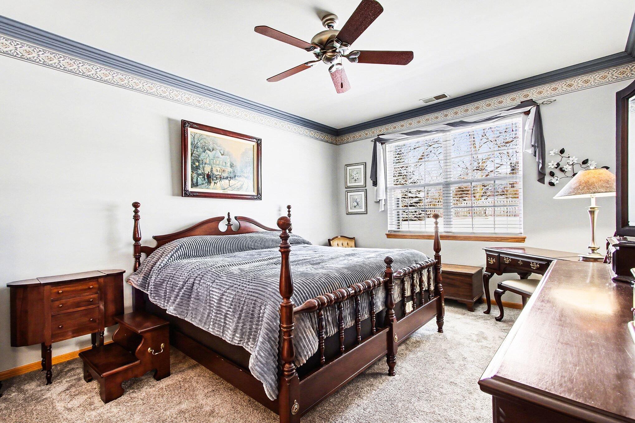 12310 80th Place Dyer, IN 46311 - Photo 15 of 37 a bedroom with a bed and a table in it