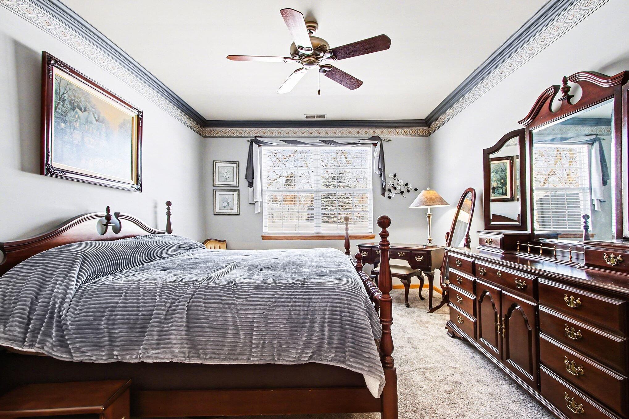 12310 80th Place Dyer, IN 46311 - Photo 16 of 37 a bedroom with bed and window