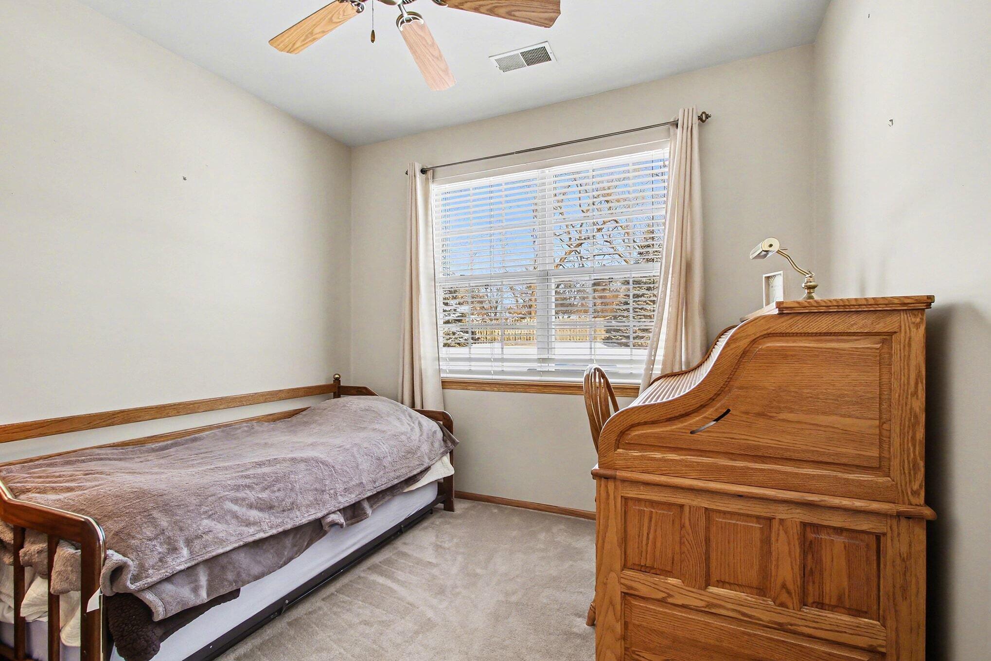 12310 80th Place Dyer, IN 46311 - Photo 20 of 37 a bedroom with a bed and next to a window