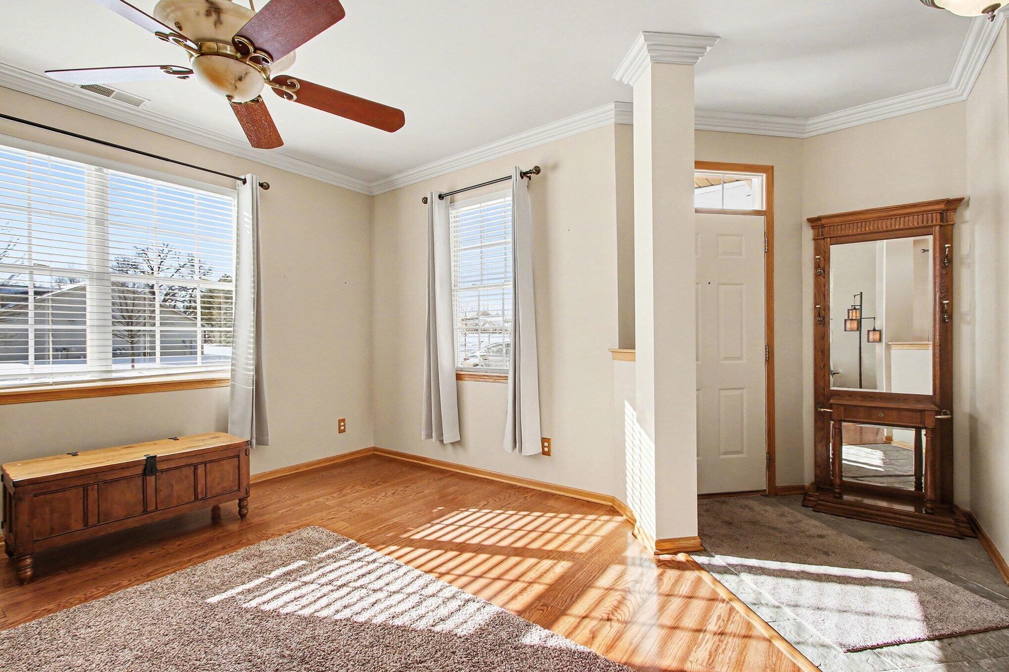 12310 80th Place Dyer, IN 46311 - Photo 5 of 37 a view of a room with wooden floor and windows