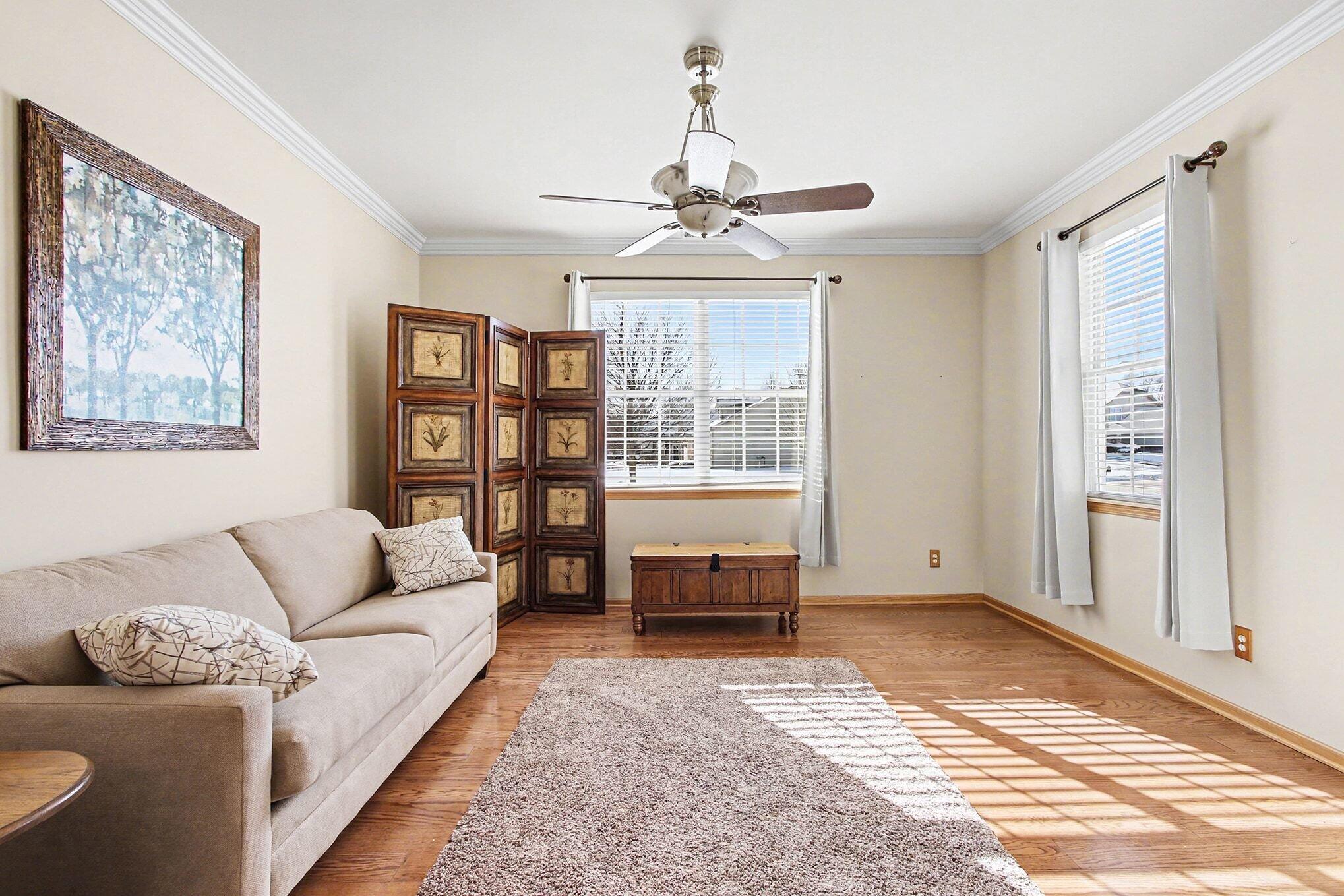 12310 80th Place Dyer, IN 46311 - Photo 7 of 37 a living room with furniture a chandelier and a window