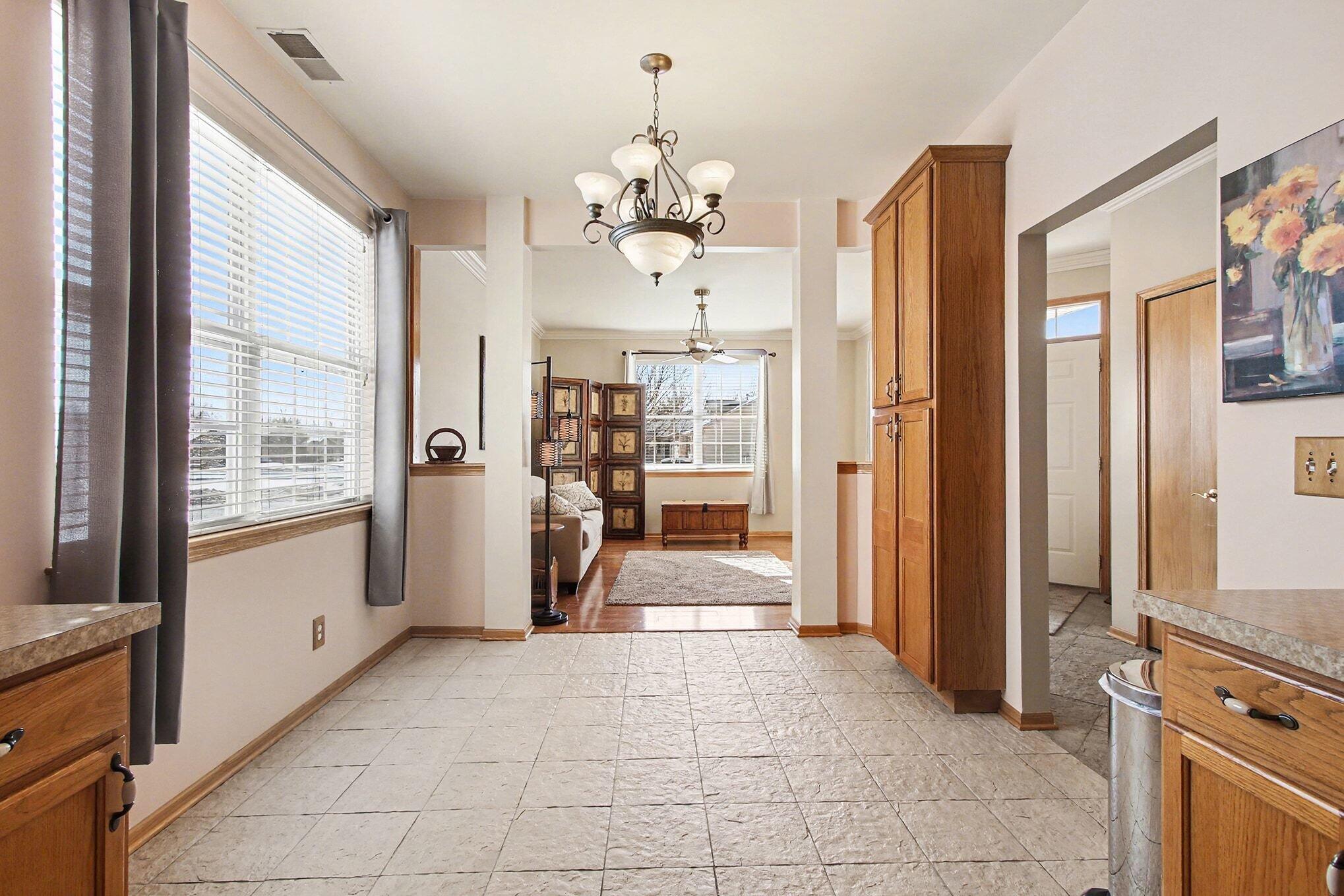 12310 80th Place Dyer, IN 46311 - Photo 10 of 37 a view of a hallway with chandelier and living room