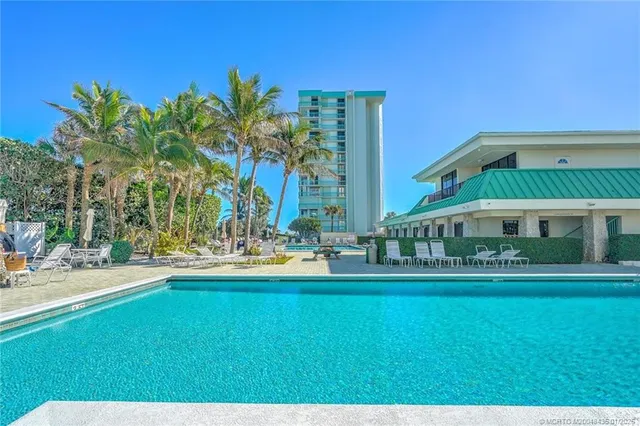 a view of a swimming pool with a yard